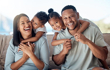 Image showing Happy family, mother and father with children in a portrait in a sofa bonding hugging and laughing together. Mom, dad and fun Mexican kids playing, kissing parents and enjoying quality time in Mexico