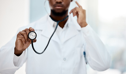 Image showing Black man doctor, stethoscope in hand and health with medical and check up in hospital. Healthcare, health insurance and professional in medicine, surgeon listening to heartbeat and cardiology.