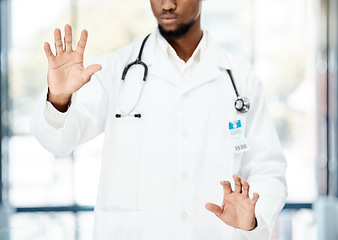 Image showing Hands, healthcare and us with a black man doctor using a touchscreen interface in the hospital for diagnosis. Ai, future and medical with a male medicine professional working on a clinic dashboard