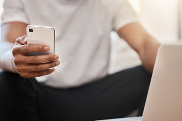 Image showing Phone, communication and hands networking on social media, surfing the internet or searching for online content. Laptop, website and man texting, reading an email or posting on a social network app