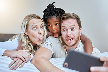 Image showing Child, parents or comic face for phone selfie in house, hotel or home bedroom on social media, memory vlog or fun. Mother, father or black girl on mobile photography technology with tongue expression