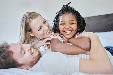 Image showing Love, adoption and family portrait, relax and smile on bed in home, happy and support with care. Mother, father and black girl, happiness and freedom in bedroom relaxing, smiling and family home