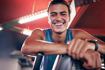 Image showing Fitness, smile and portrait of man in gym, happiness in workout exercise with equipment in studio. Happy personal trainer or coach with smile on face, motivation and relax on break at sports training