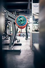 Image showing Empty gym interior, weights and healthclub for weightlifting, bodybuilding and strength training. Nobody, wellness and workout background with equipment for arm exercise with gym equipment