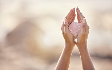 Image showing Woman, crystal hands and zen outdoor in nature for healing wellness, mindfulness or peace with spirit rock. Rose quartz, energy stone or calm spiritual meditation for growth, health or relax for girl