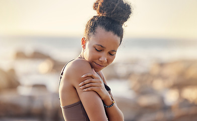 Image showing Fitness, black woman and arm pain from sports injury, exercise or training workout accident in the outdoors. African American female suffering from sore shoulder muscle, inflammation or tension