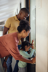 Image showing Family, love and animal shelter with a girl, mother and father looking through a window together in a pet store. Charity, kids and community with a woman, man and daughter at an adoption center
