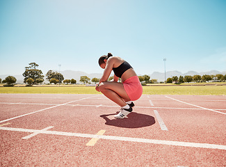 Image showing Tired, rest and woman athlete after running, sport and runner workout outdoor. Training fatigue of a fitness, sports run and body health exercise on a field in the summer sun for a track race