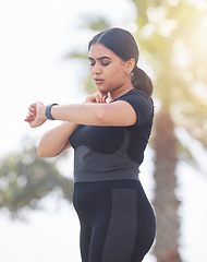 Image showing Young woman, fitness and heart rate, neck pulse and training plus size body in urban city. Sports runner, athlete and indian girl check smart watch, health progress and exercise time tracking in park