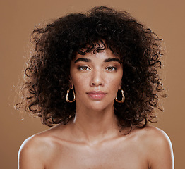 Image showing Portrait, skincare and black woman in studio for hair, skin and beauty, grooming and hygiene on brown background. Face, wellness and girl model with natural, afro and glam cosmetic with makeup