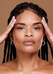 Image showing Portrait, hair and black woman in studio for skincare, beauty and braids care against brown background. Face, skin and girl model serious about wellness, hygiene and grooming, natural hair and mockup