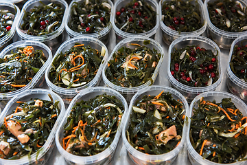 Image showing Different fish and chuka wakame laminaria seaweed salad