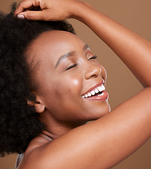 Image showing Black woman, face and smile for skincare cosmetics, makeup of luxury treatment against brown studio background. African American female relax smiling in satisfaction for facial care and perfect skin