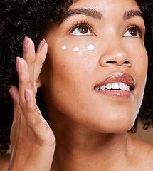 Image showing Young black woman, skincare cream and beauty, sunscreen makeup product and luxury facial treatment for body wellness. African girl model, face cream and spf lotion, natural cosmetics and dermatology