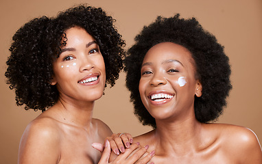 Image showing Skincare, portrait and women in studio for face, cream and product, beauty and wellness on brown background. Friends, black woman and facial, dermatology and luxury cosmetics, skin and hygiene mockup