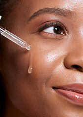 Image showing Black woman, dropper and facial skincare cosmetics for beauty, hydration or oil treatment for healthy face. Closeup of African American female applying serum to cheek for skin hydrate, glow or shine