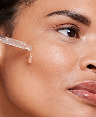Image showing Oil, skincare and woman for beauty, product and cleaning, wellness and hygiene closeup. Face, facial and serum by model and essential oils, retinol or anti aging skin moisturiser, liquid or mask