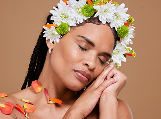 Image showing Beauty, skincare and flowers in hair of black woman for natural, spring and luxury cosmetics. Wellness, relax and makeup with face of girl model for self love, fresh and creative in studio background