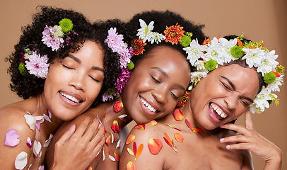 Image showing Flowers, skincare and women in studio for beauty, wellness and nature product self care on brown background mockup. Friends, flower and crown by black women happy with floral treatment and aesthetic