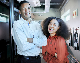 Image showing Engineer, cybersecurity and happy team together in a server room or data center for maintenance for cloud computing or information technology system. IT man and black woman, happy about teamwork