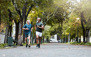 Image showing Fitness, friends and senior men running in road of city for health, wellness and body care. Exercise, training and elderly males run together enjoy being active, workout and exercising in retirement