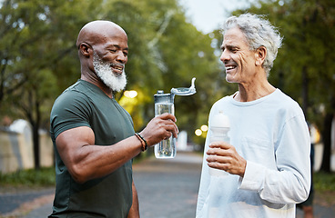 Image showing Exercise, water bottle and senior men or friends together at a park for running, walking and fitness during retirement. Happy people in nature for a cardio workout and hydration while talking outdoor