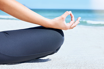 Image showing Yoga, meditate and beach zen hand for chakra and wellness training by the ocean sand and sea. Woman in nature for mind health, exercise and breathing training in summer for mindfulness and balance