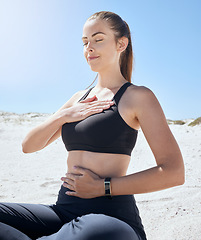 Image showing Yoga, meditation and beach fitness of a woman athlete with a zen prayer and mindfulness in nature. Meditate, peace and wellness exercise by the ocean sand for chakra, workout and relax sea pilates