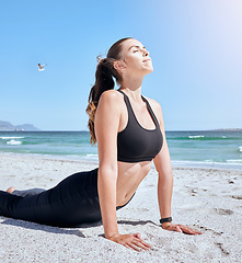 Image showing Beach yoga, health and woman stretching for body healthcare, fitness workout or outdoor freedom exercise. Pilates cobra pose, sky peace and girl training for mindset wellness on ocean tropical island