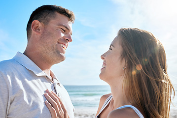 Image showing Smile, love and couple at the beach while on holiday or romantic summer honeymoon in greece. Happy, care and calm man and woman with romance, embracing and bonding in nature by the ocean on vacation