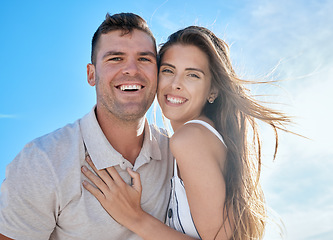 Image showing Happy couple, love and travel on a summer vacation on a blue sky for freedom, energy and fun for a healthy marriage. Portrait of a man and woman outdoor with a smile, commitment and fun on holiday