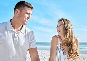 Image showing Love, beach relax and couple on vacation, holiday or summer trip. Romance, travel and man and woman talking, having fun and enjoying quality time together outdoors on sandy seashore or ocean coast.