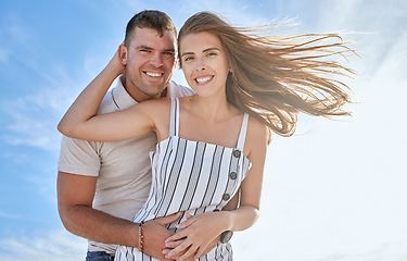 Image showing Love, blue sky and portrait of couple hug on romantic outdoor date for fun, bonding or vacation freedom. Support trust, peace and marriage partnership of man and woman on Toronto Canada honeymoon