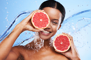 Image showing Fruit, skincare and black woman smile with grapefruit for facial wellness and skin glow. Portrait of a woman model with water splash and vitamin c for beauty, cosmetic nutrition and natural detox