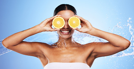 Image showing Orange, skincare and woman with water splash smile about fruit, wellness and vitamin c health. Skin beauty, facial and cosmetic eye treatment of a black woman model with happiness about nutrition
