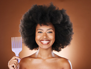 Image showing Hair care, afro and portrait of black woman with comb for wellness, grooming treatment or healthy hair growth. Salon, combing brush and face of African model with product for hairstyle maintenance