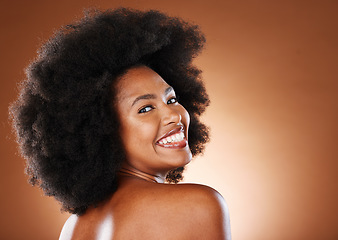 Image showing Beauty, skincare and a happy black woman with a smile and afro looking back on studio background. Health, wellness and youth, a woman with body care, healthy glowing skin and happy grooming lifestyle