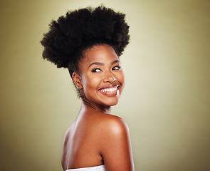 Image showing Skincare, black woman and natural beauty in studio for wellness, healthy glow and hair growth on green background mockup for marketing. Happy young african woman model with cosmetics skin care shine