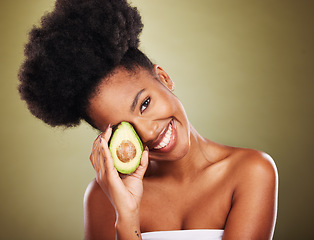 Image showing Black woman, skincare and beauty in studio with avocado for health, nutrition or moisturizer for wellness. Woman, model and fruit for radiant glow skin, shine and healthy against cosmetics background