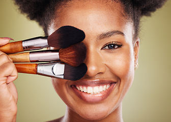 Image showing Black woman, makeup brush and smile in studio for beauty portrait, wellness and cosmetics by backdrop. African woman, model and face with cosmetic tools, hand or happy for skincare by background