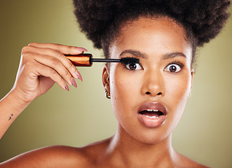 Image showing Black woman, surprise eyes and cosmetics mascara or makeup, natural beauty and skincare glow in studio. African girl model, facial cosmetology wellness and eyelash product care with shocked face