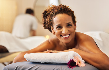 Image showing Black woman, smile and relax in massage at spa for cosmetic skincare or beauty treatment at a resort. Portrait of African American female lying on massaging table or bed smiling for luxury wellness