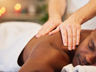 Image showing Black man, relax and massage at spa for health, wellness and sleeping rest at luxury resort. African man, salon bed and physical therapy for healing, holistic treatment and zen on holiday vacation