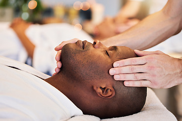 Image showing Massage, sleeping and face of a black man at a spa for peace, relax and luxury service with the hands of a worker. Wellness, skincare and African person at a salon for stress relief with a masseuse