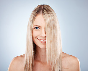 Image showing Hair, woman and portrait of blond lady with healthy hair for beauty and haircare. Hair care, hairstyle and face of blonde female for cosmetology or wellness on a grey studio background