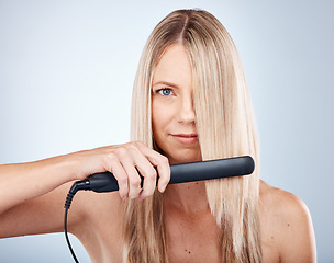 Image showing Hair care, portrait and face of woman with hair straightener for luxury styling, hairstyle maintenance or hairdressing. Spa salon, cosmetics studio product and model with hair iron for hair treatment