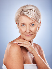 Image showing Face, portrait and skincare with a senior woman in studio on a gray background for wellness or natural care. Beauty, antiaging and luxury with a mature female posing to promote skin or bodycare