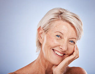 Image showing Face, beauty and skincare with a senior woman in studio on a gray background for wellness or luxury. Portrait, cosmetics and antiaging with a mature female posing to promote a natural product