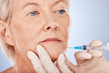 Image showing Plastic surgery, syringe and senior woman with needle, skincare injection and wellness on grey studio background. Health, mature lady and elderly female with body care, cosmetics or dermatology.