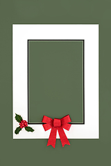 Image showing Christmas Red Bow and Holly Berry Background Frame 